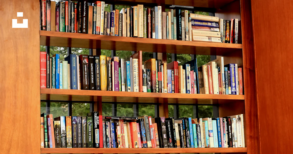 A bookshelf with books photo – Free Library Image on Unsplash