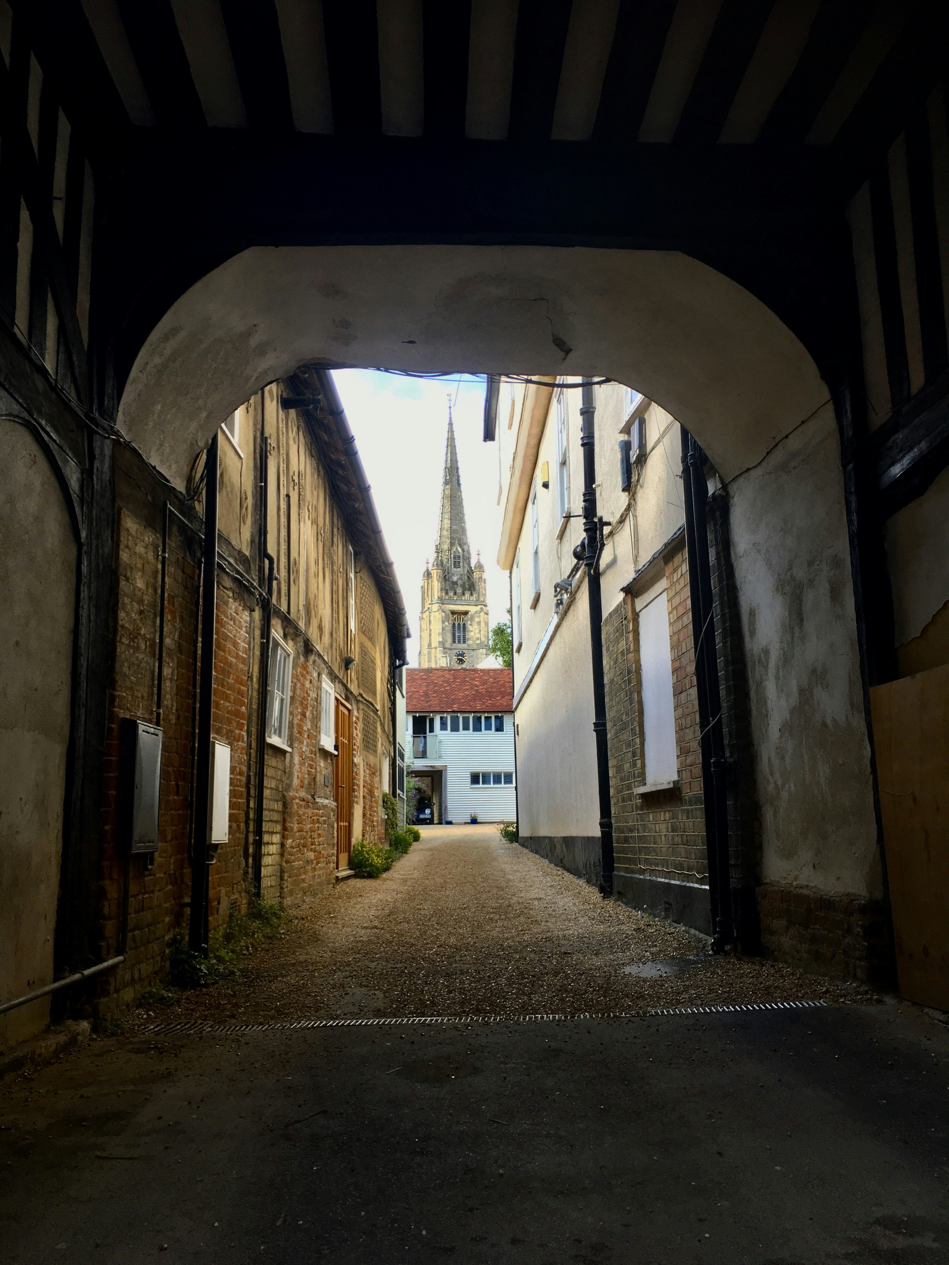 a view of a street through an old building