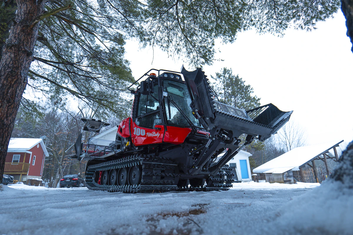 Snow removal truck clearing a driveway in Edmonton Alberta
