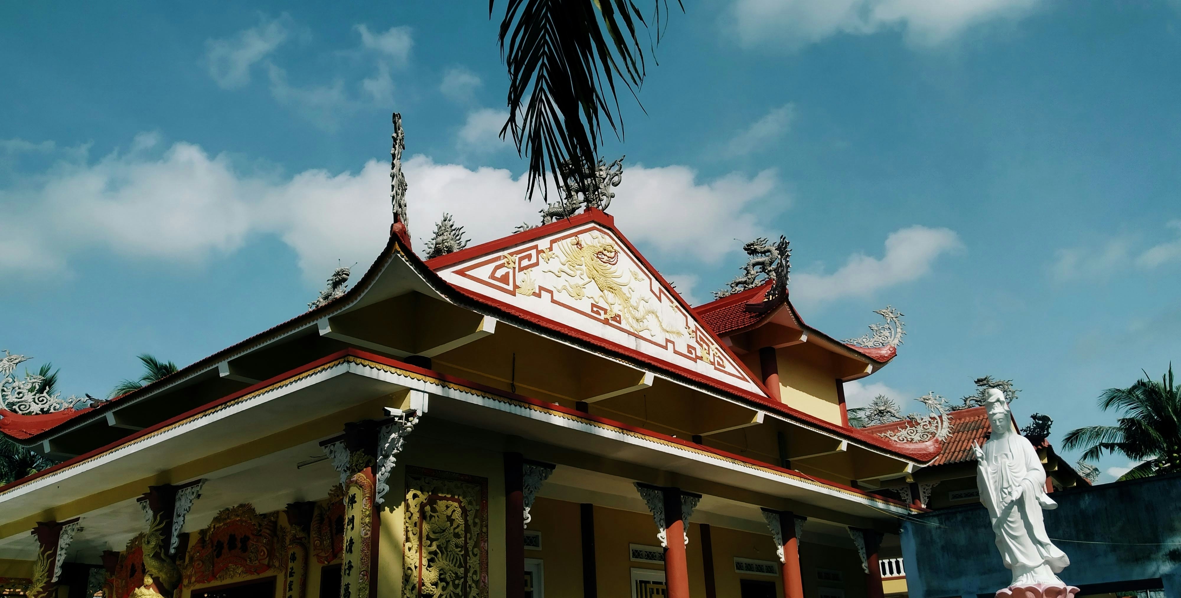 a building with a statue in front of it, 