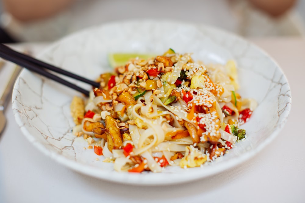 a plate of pasta with a fork