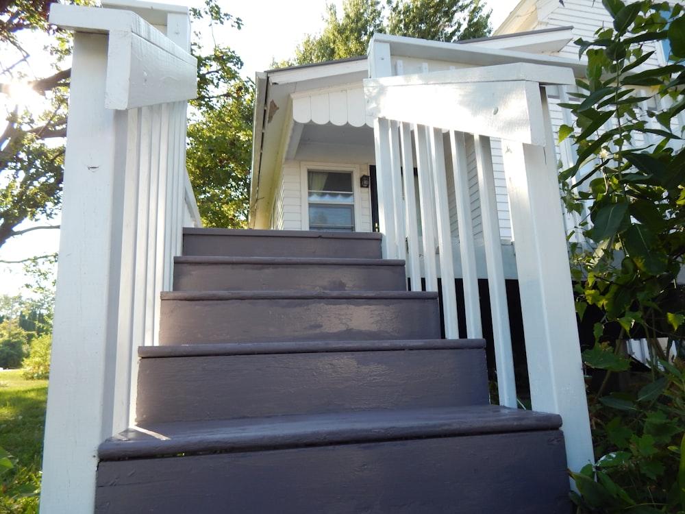 a wooden staircase leading up to a house