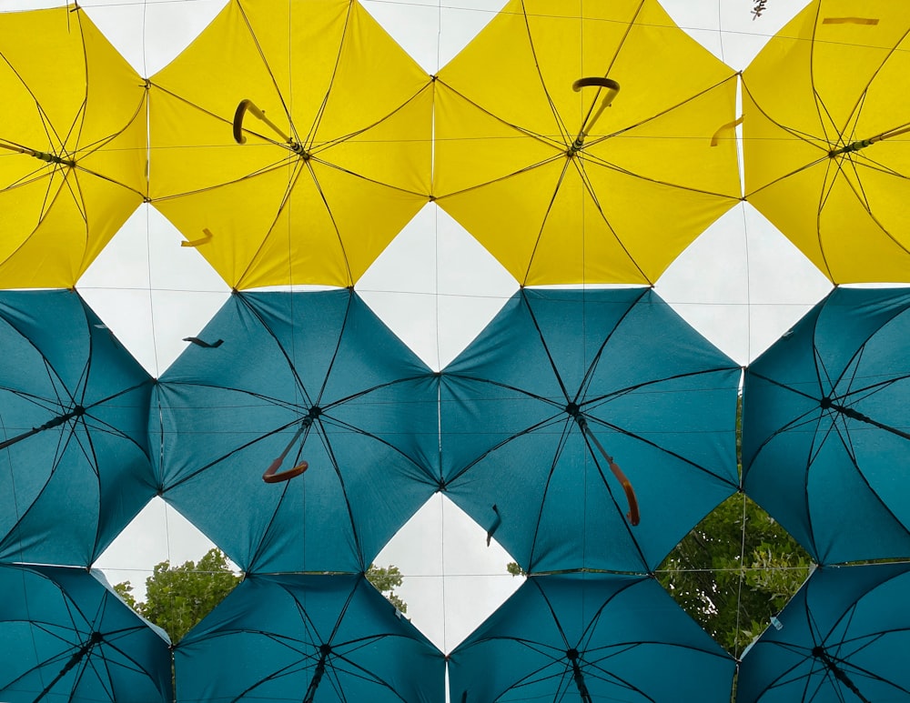 a group of umbrellas from a ceiling