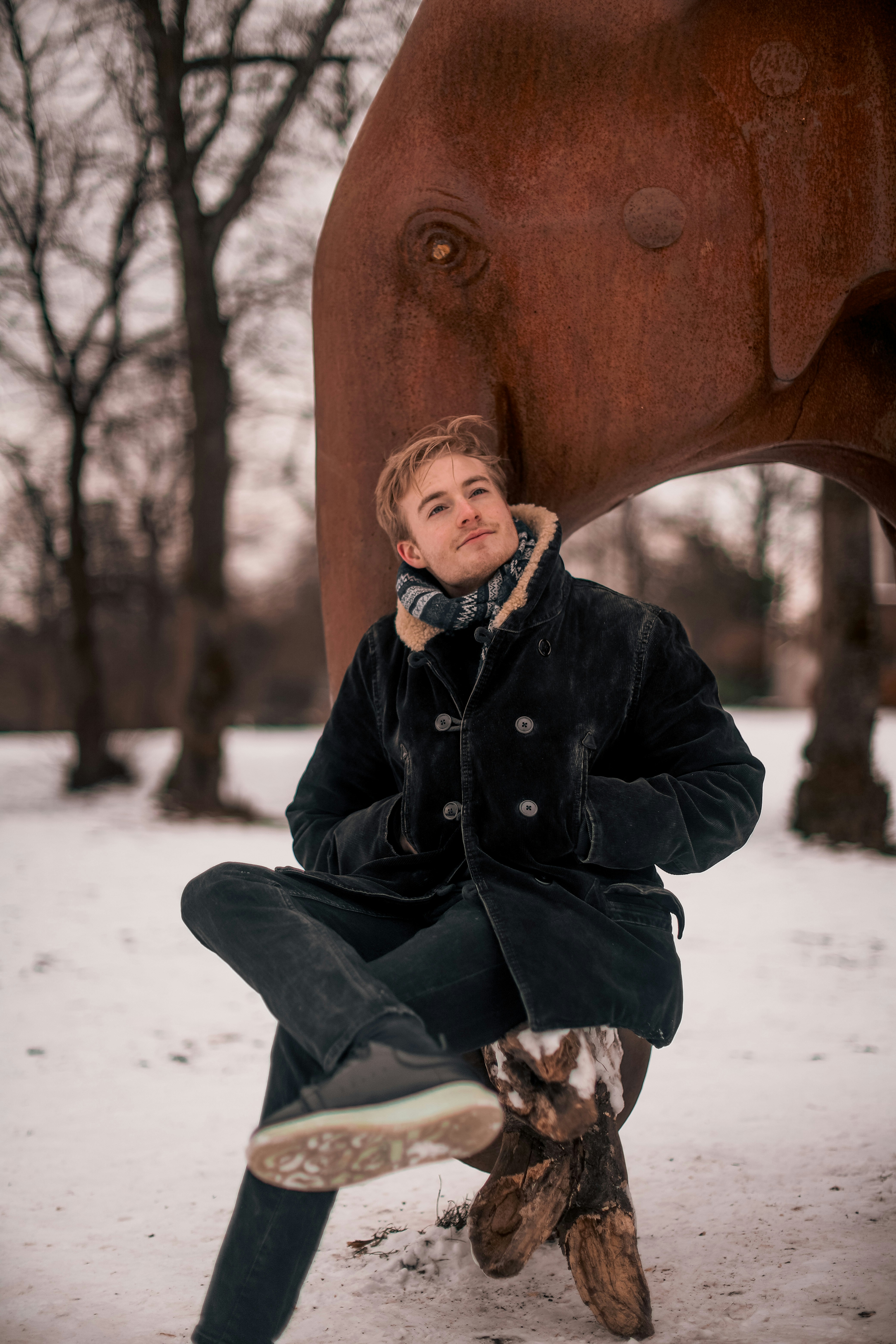 a person sitting on a statue