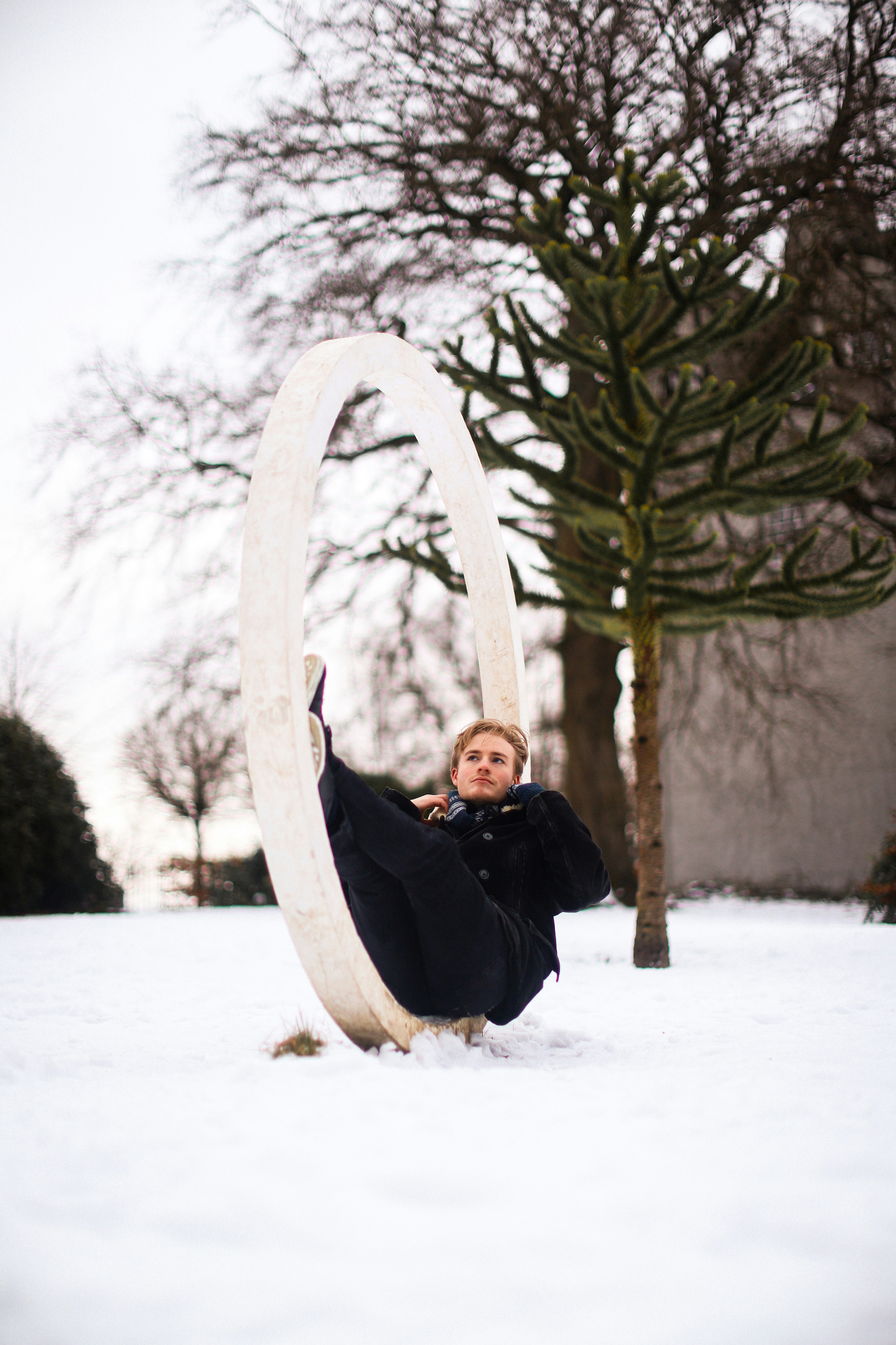 a boy holding a snowboard