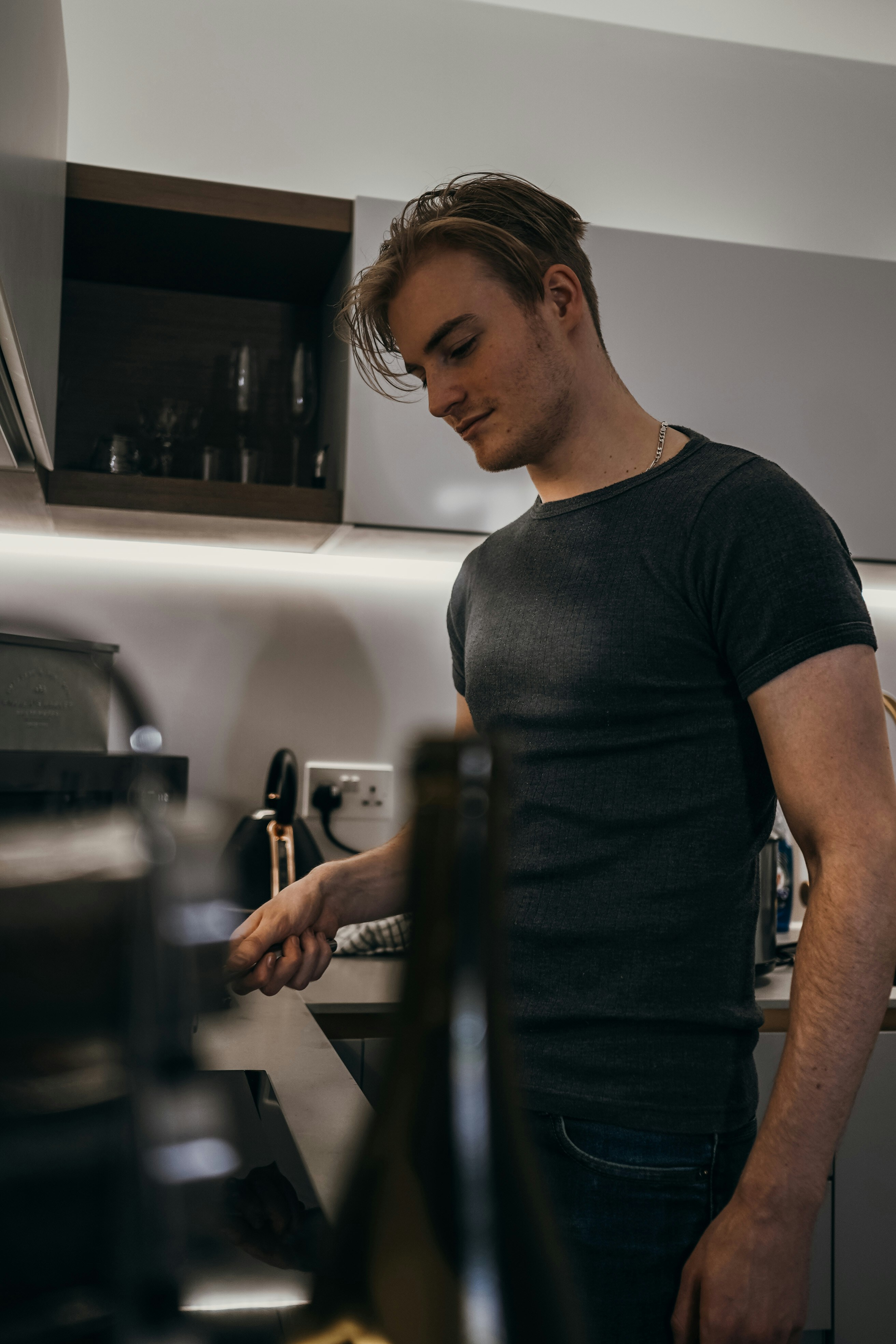 a man in a black tank top