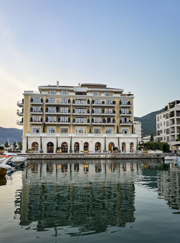 a building with many windows by water