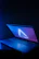 Close-up of a laptop battery with cyber-style blue neon highlights.