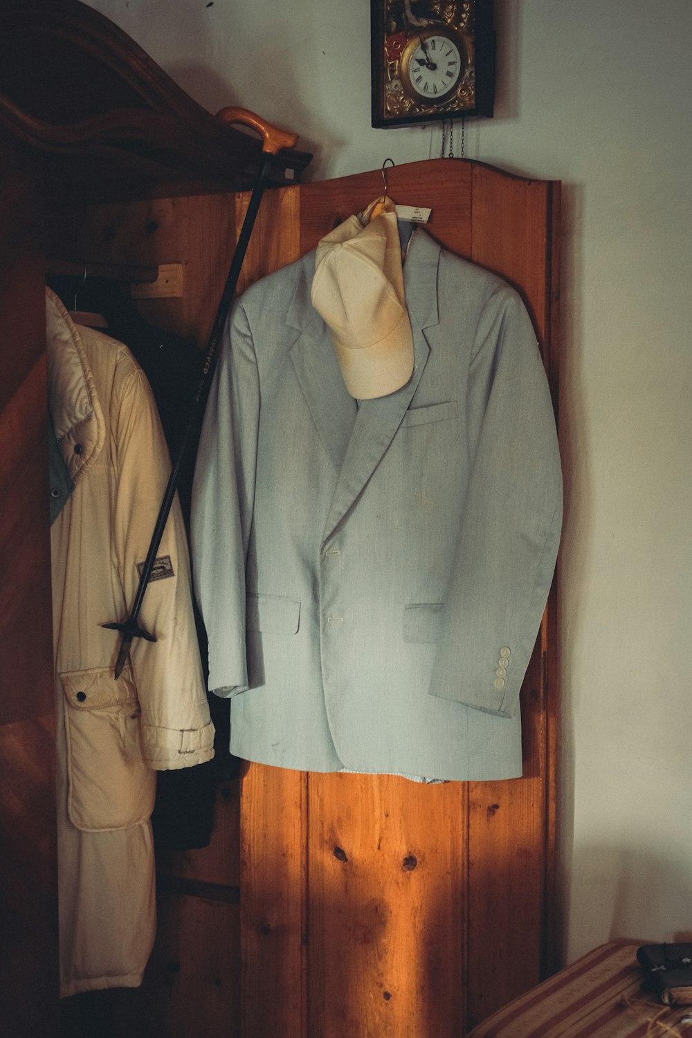 a coat rack with clothes on it