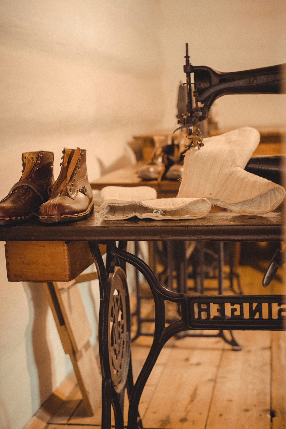 a table with a pair of boots on it