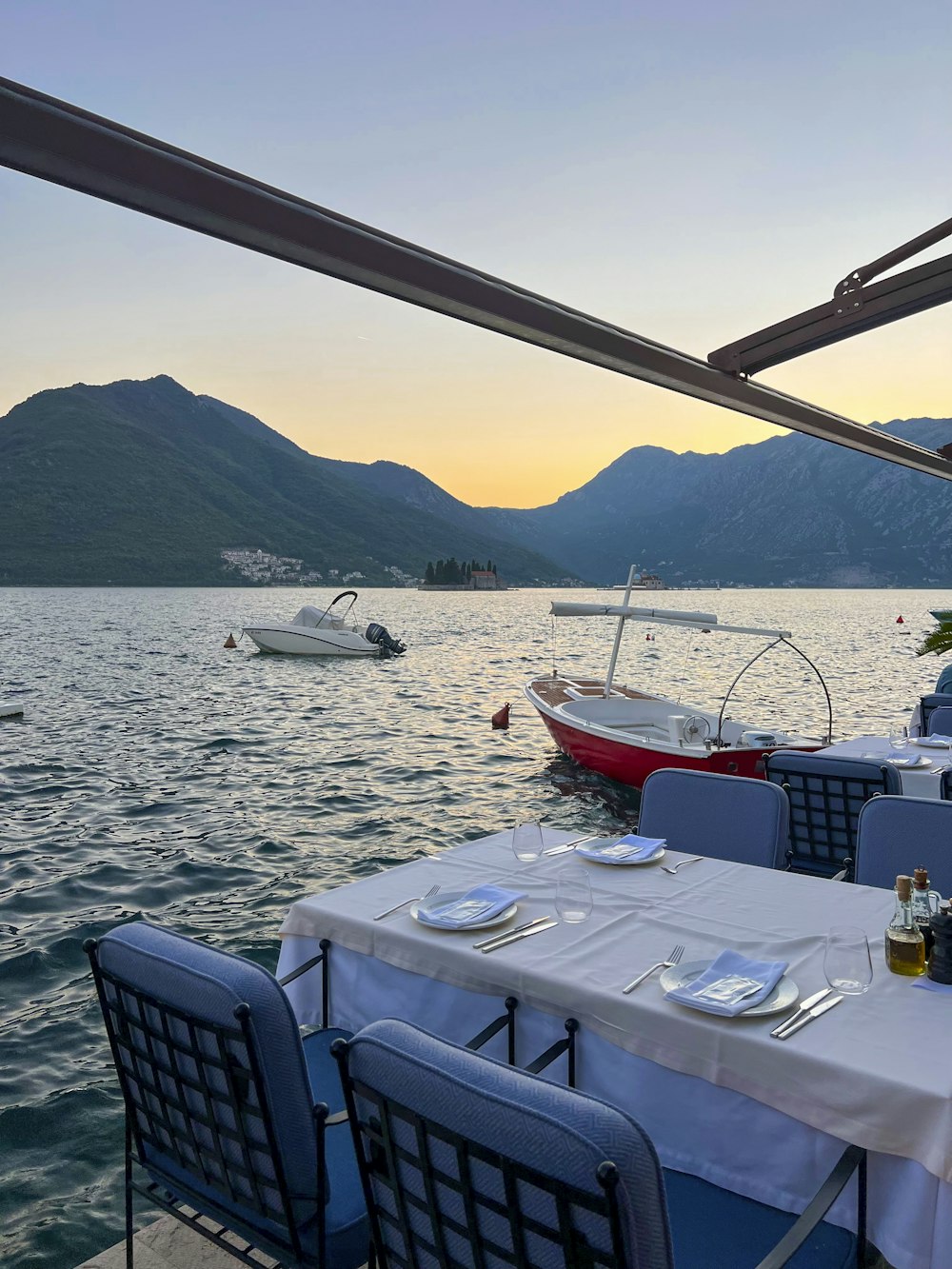 a table and chairs on a boat