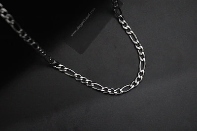 Pure platinum chains displayed on a sleek black background highlighting their cool luster.