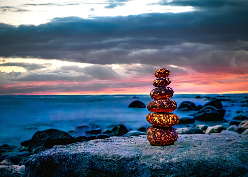 a colorful light bulb on a rock