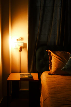 Calm, softly lit bedroom prepared for sleep at night