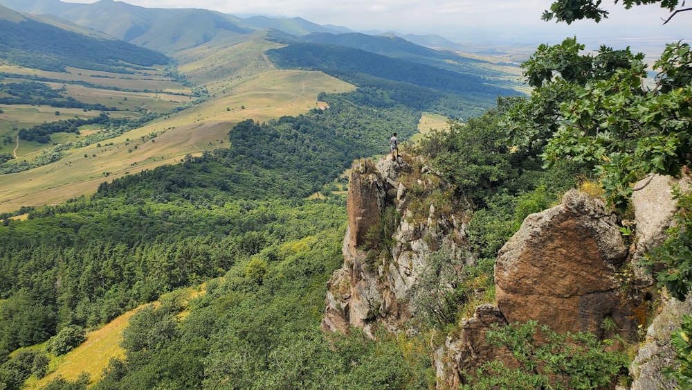 a person standing on a rock