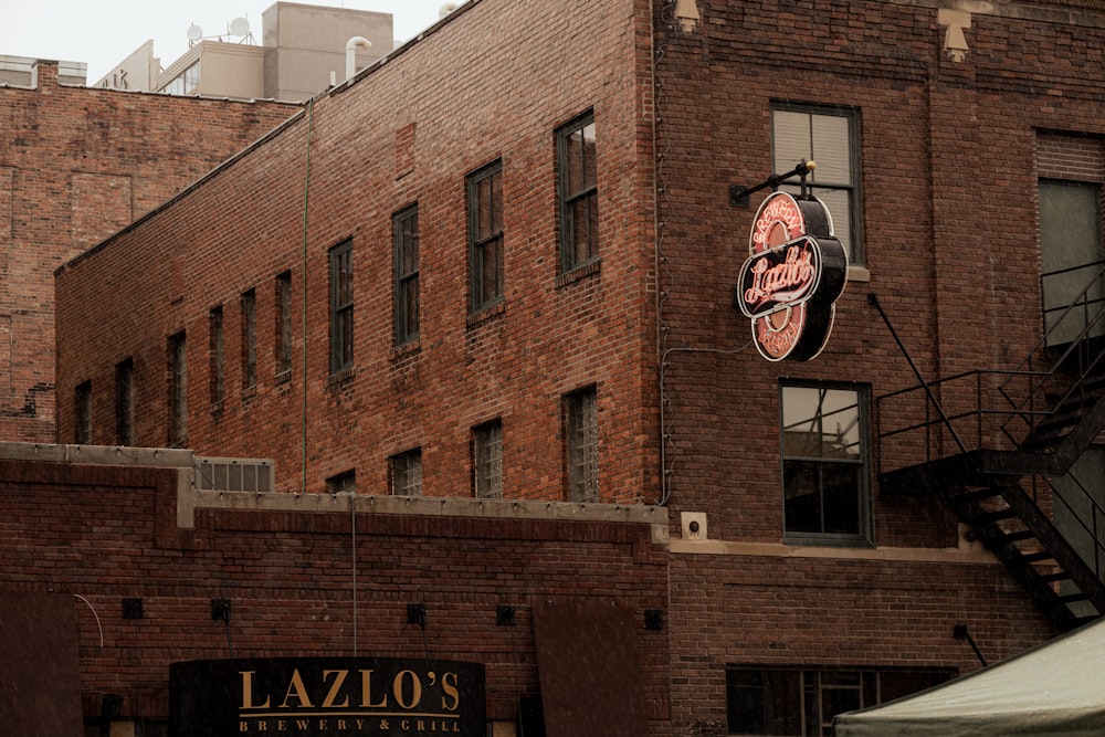 a brick building with a sign on it