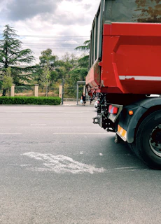Logancrest truck parked beside a mountain road under a moody, overcast sky