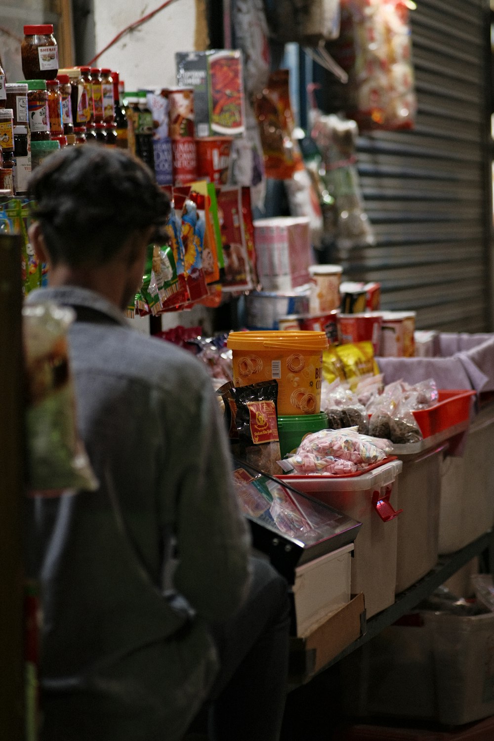 a man standing in a room full of food