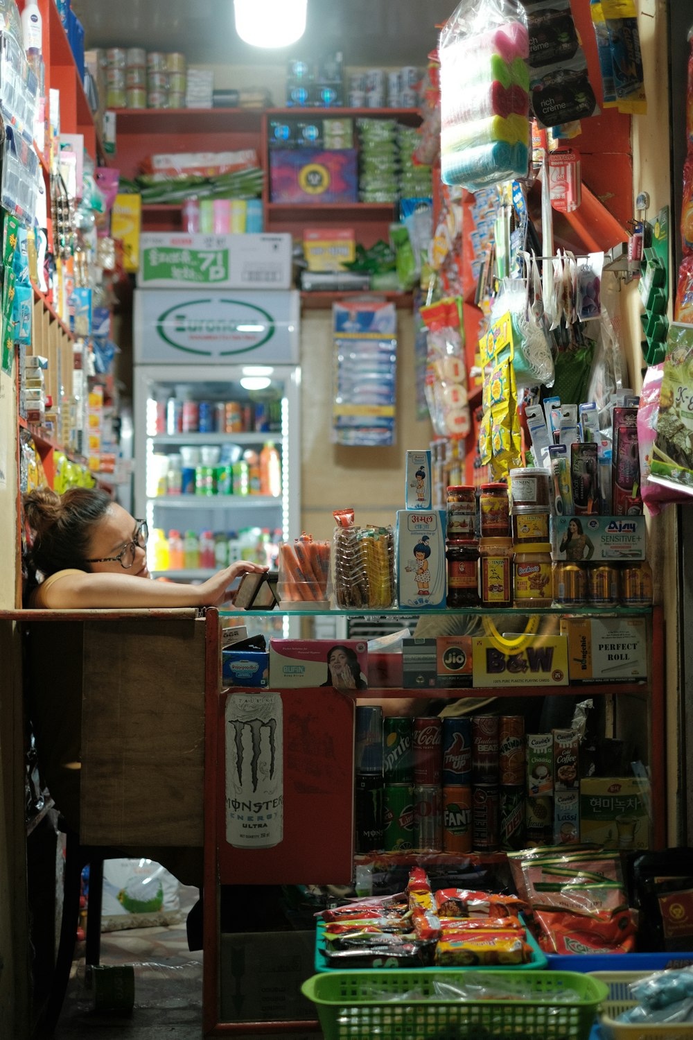 a person sitting at a counter in a store