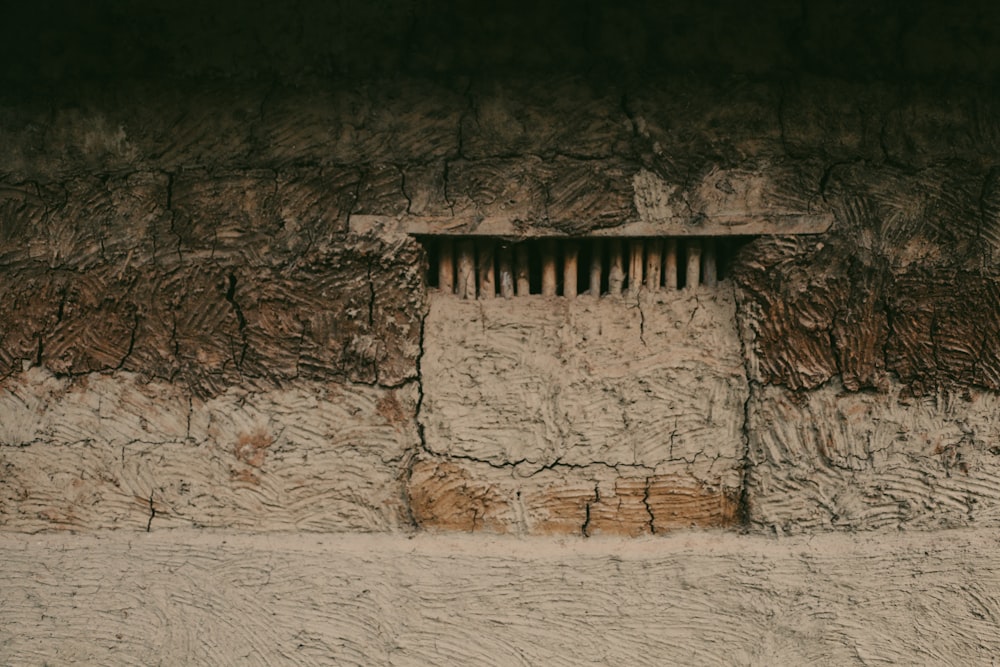 a stone wall with a carved face