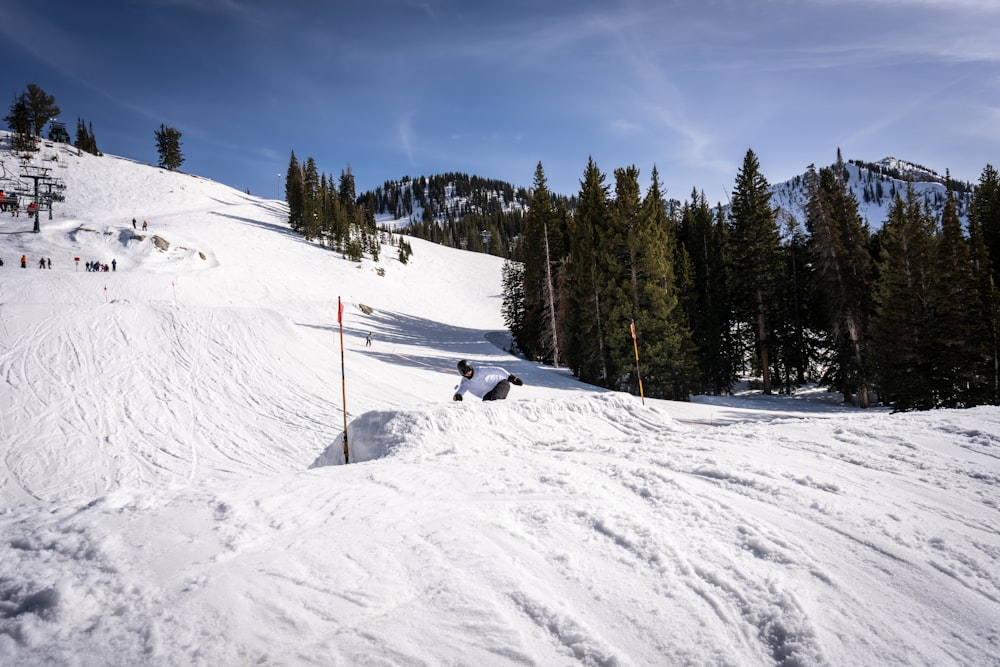 a person lying on the snow