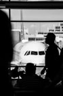 a man stands next to a plane