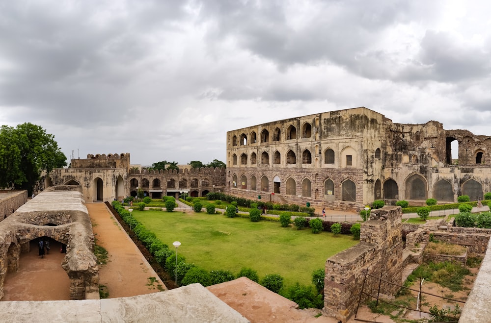 a large stone building with a courtyard