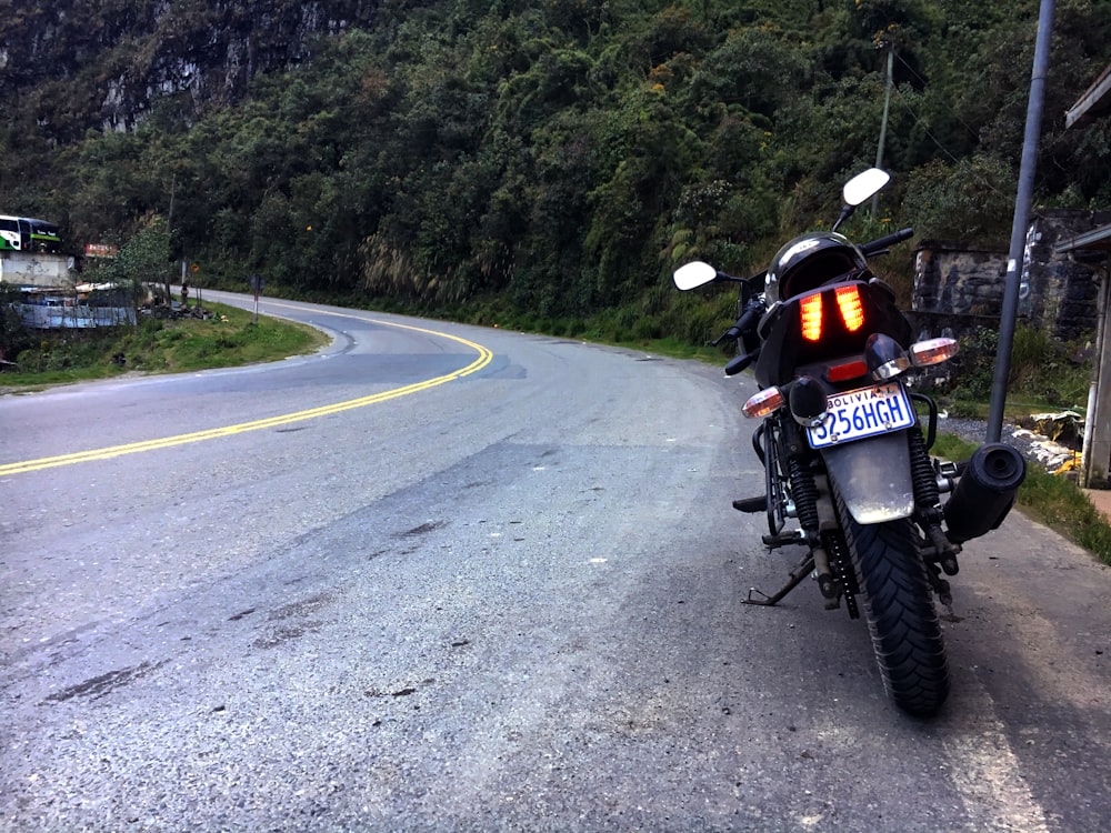 a motorcycle parked on the side of a road