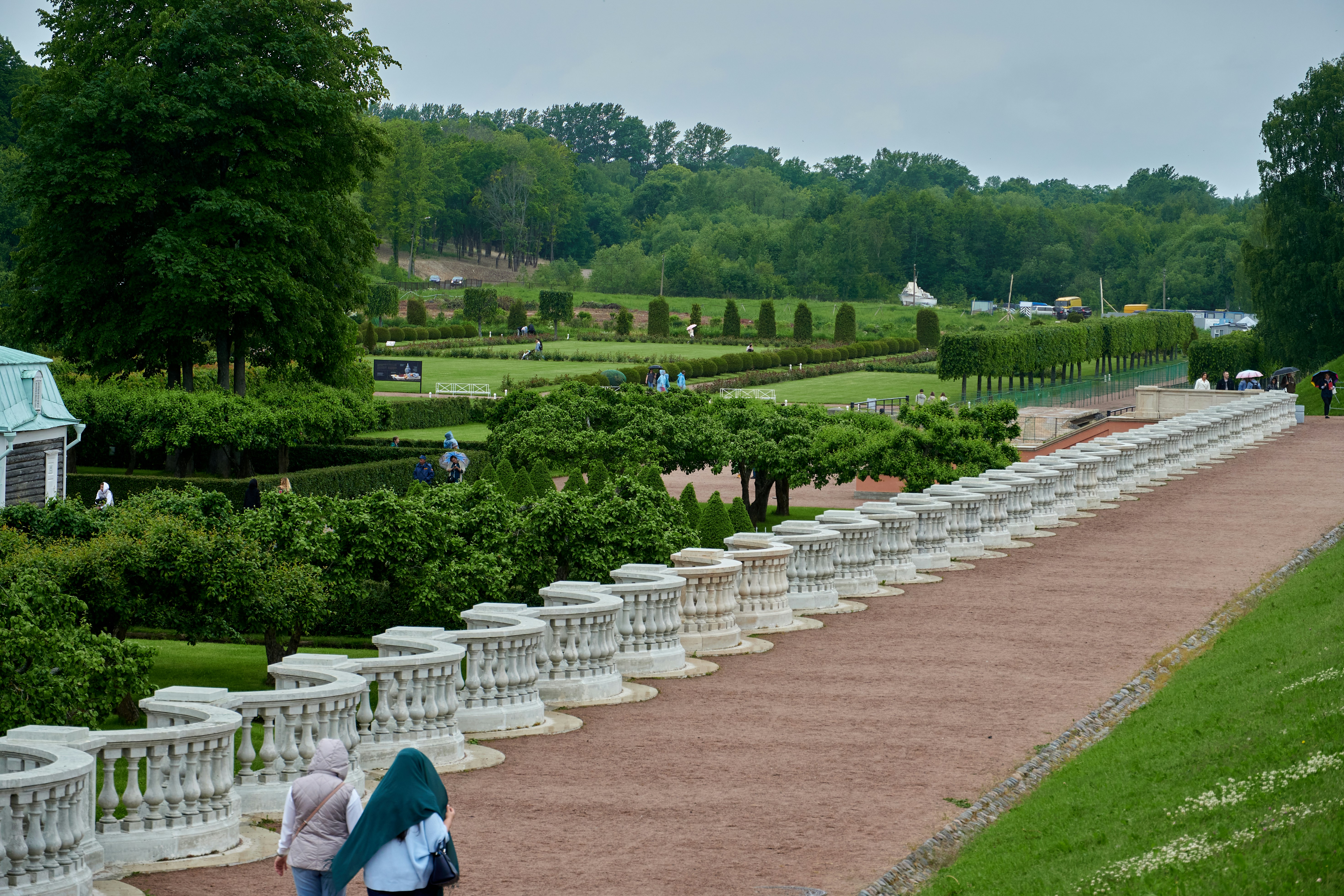 people walking on a path in a park
