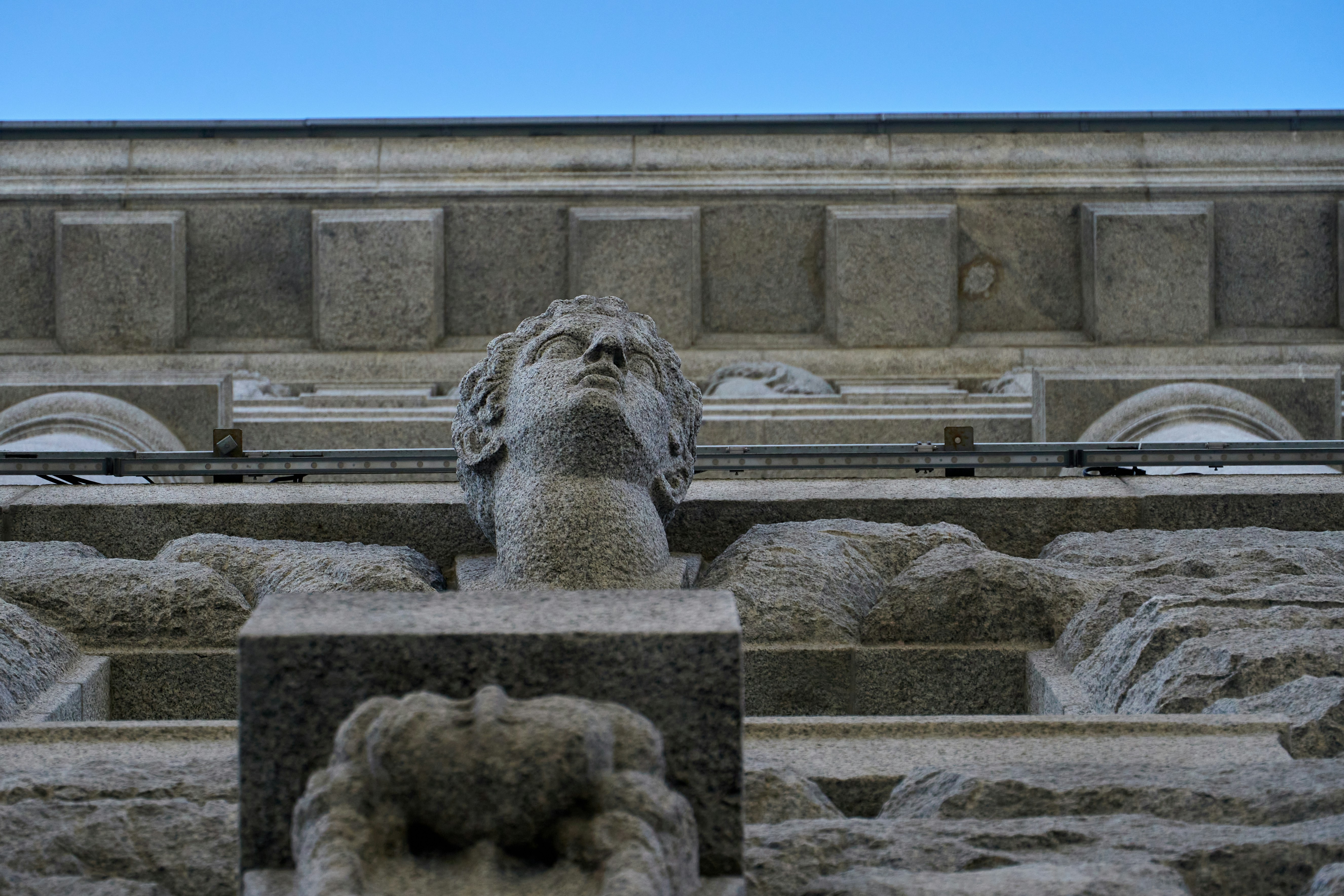 A stone statue of a head photo Free Archaeology Image on Unsplash