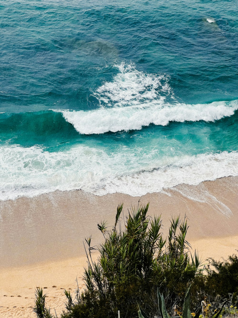 a wave crashing on a beach