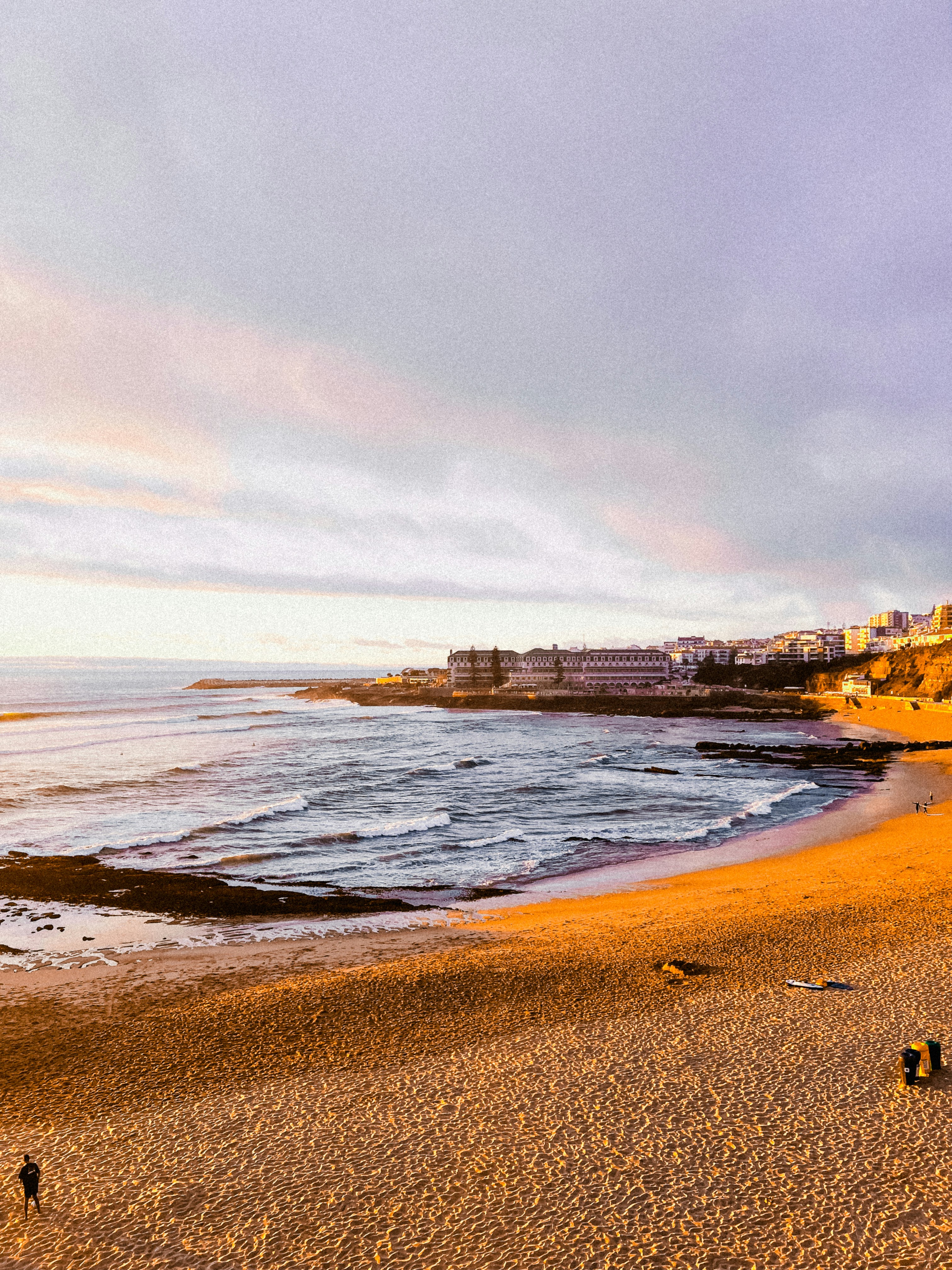 Chatham lighthouse above a sandy beach at golden hour