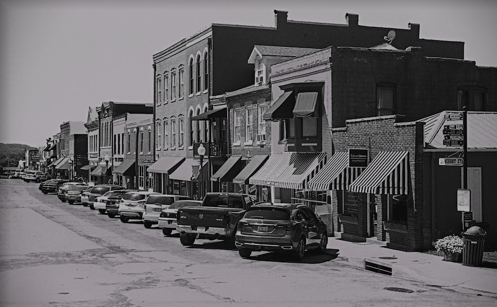 a row of cars parked on a snowy street