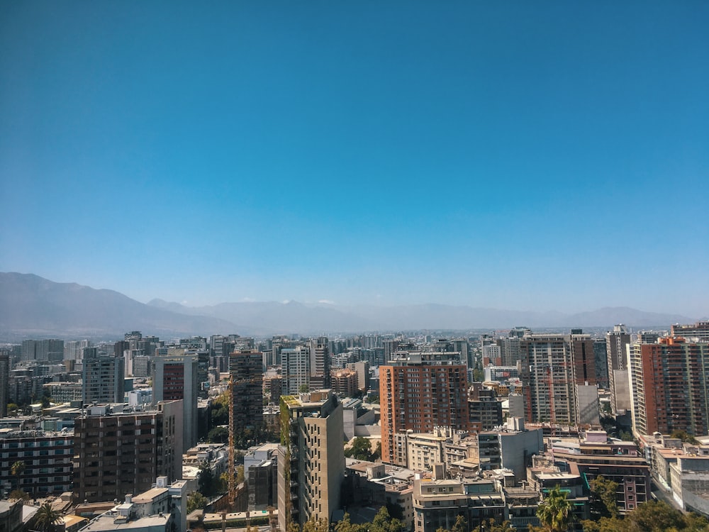 a city with mountains in the background