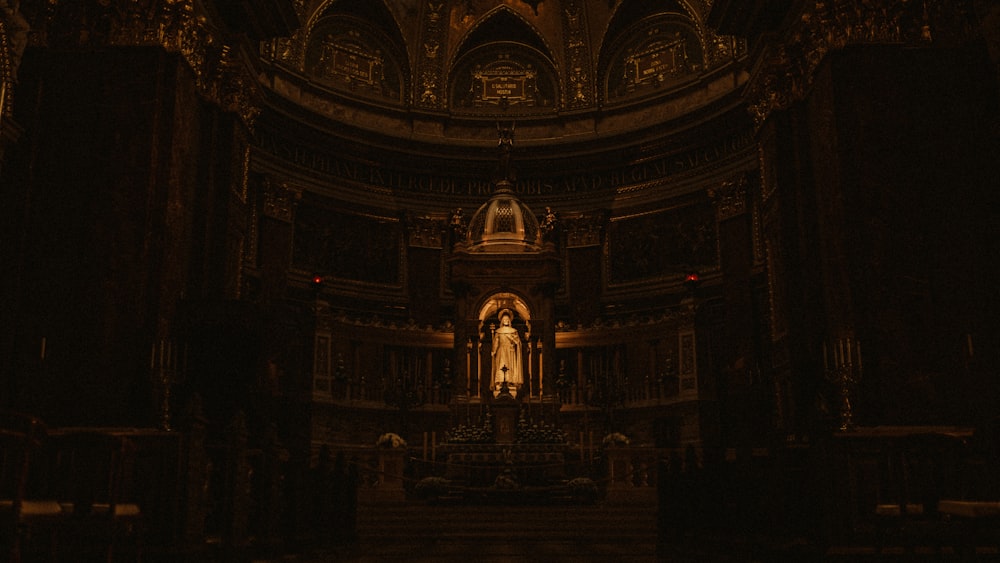 a statue in a dark room