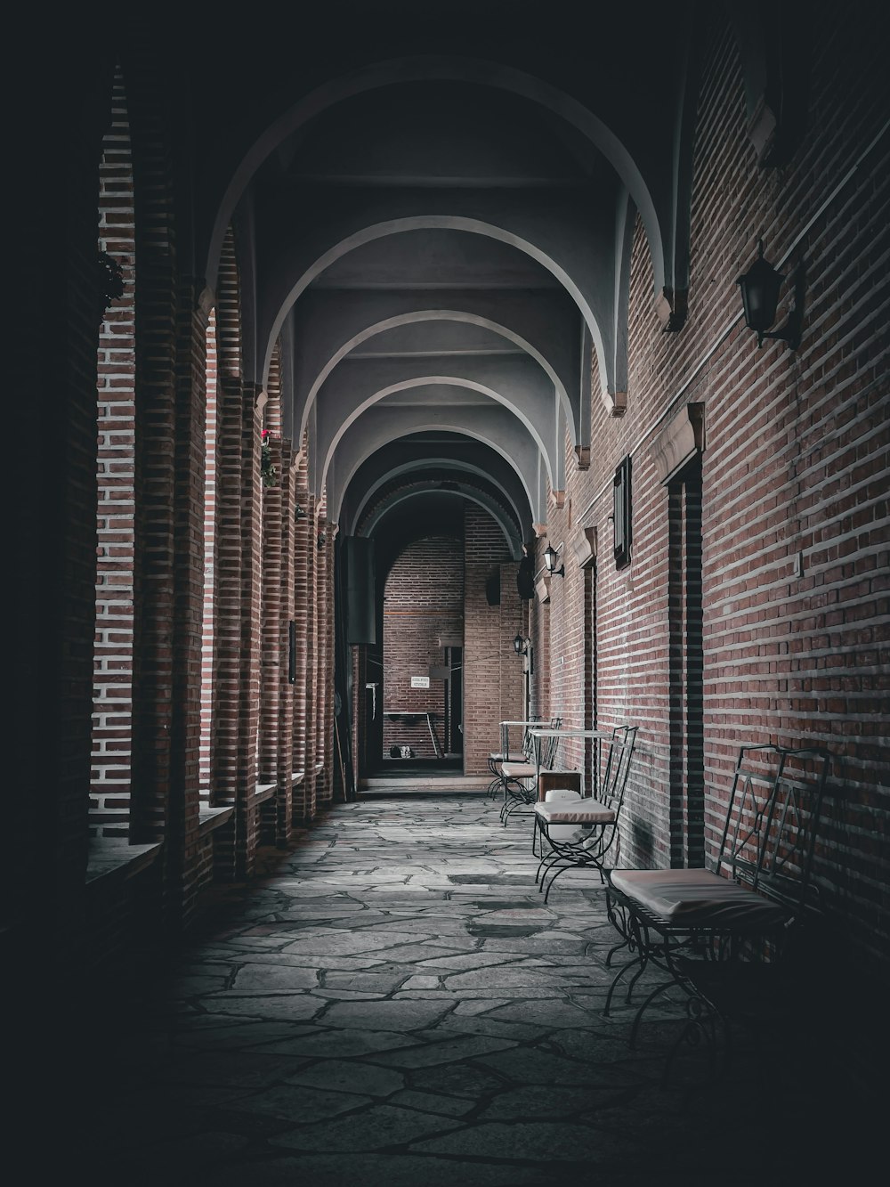 a brick building with benches