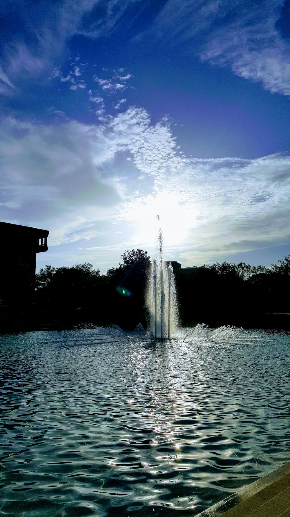 a fountain in a lake