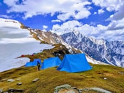 a group of tents on a mountain