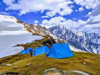 a group of tents on a mountain