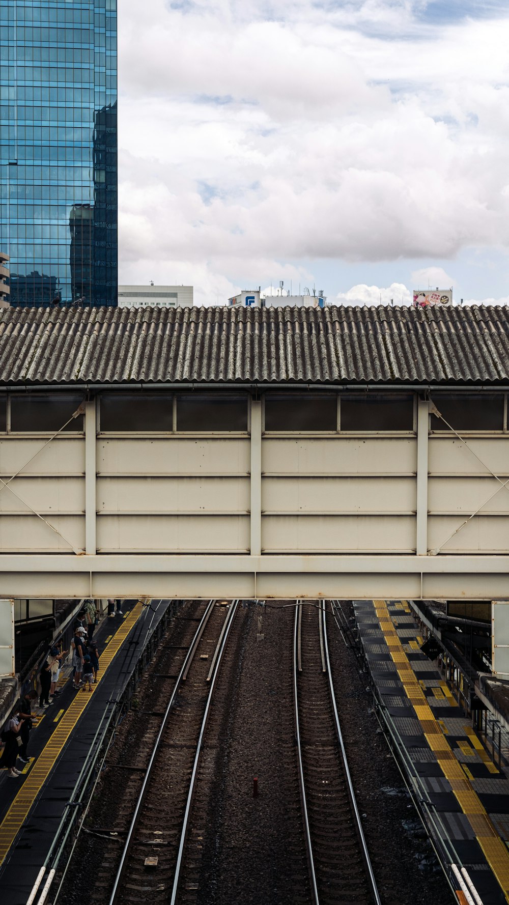 a train station with people waiting