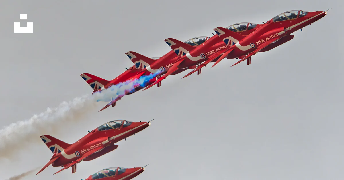 A Group Of Red Airplanes Flying In The Sky Photo Free Aircraft Image a-group-of-red-airplanes-flying-in-the-sky-photo-free-aircraft-image