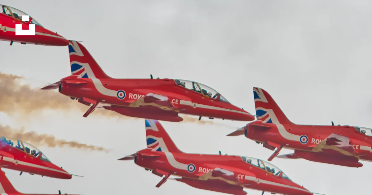 Red Color Flight A group of red airplanes flying in the sky photo – Free Aircraft Image ...