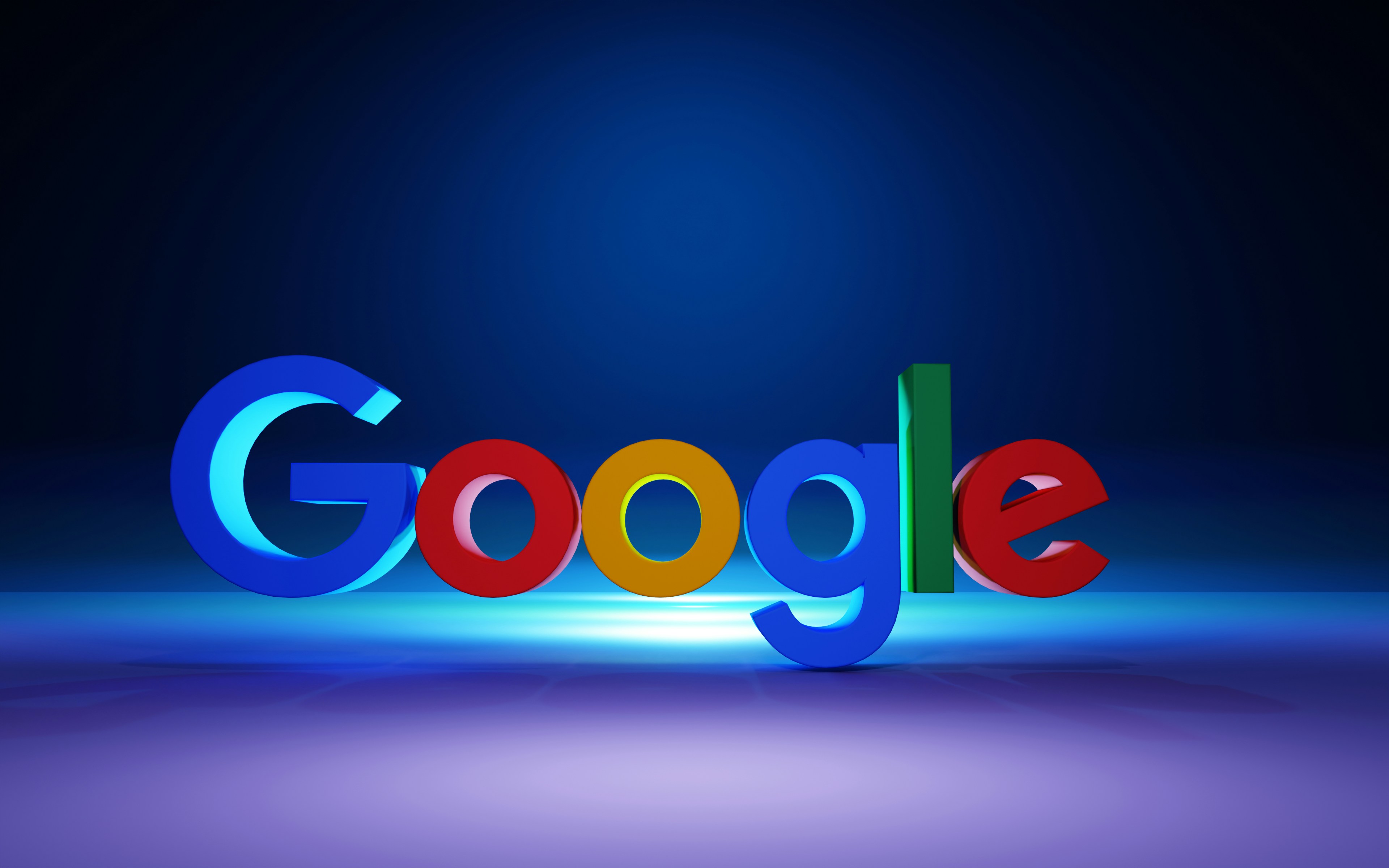 The Google logo in colorful 3D letters on a dark blue surface