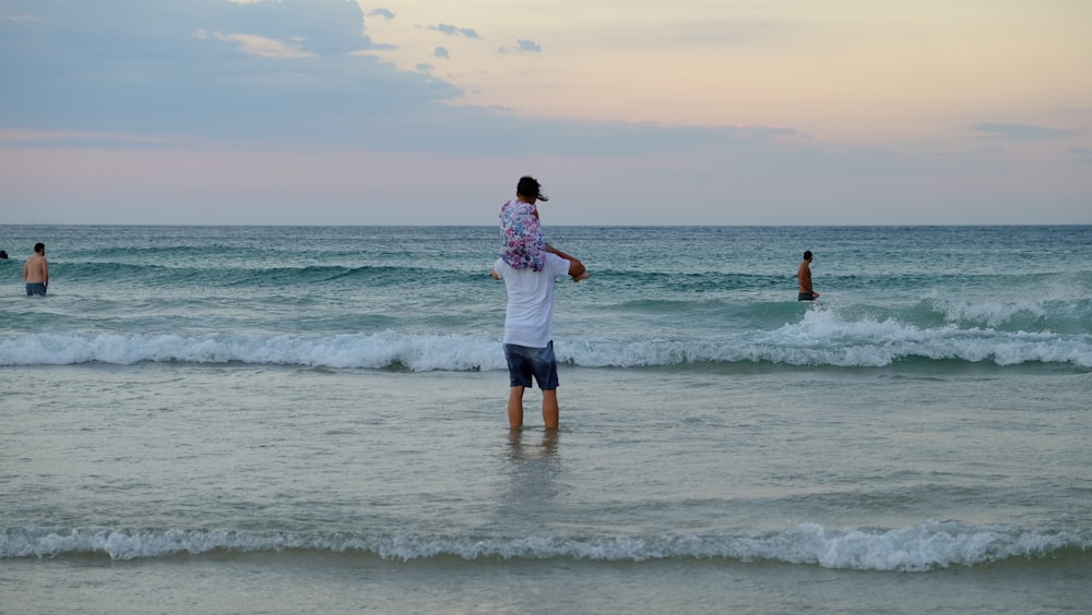 a man standing in the ocean