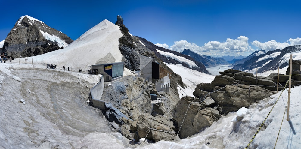 a group of people walking on a snowy mountain