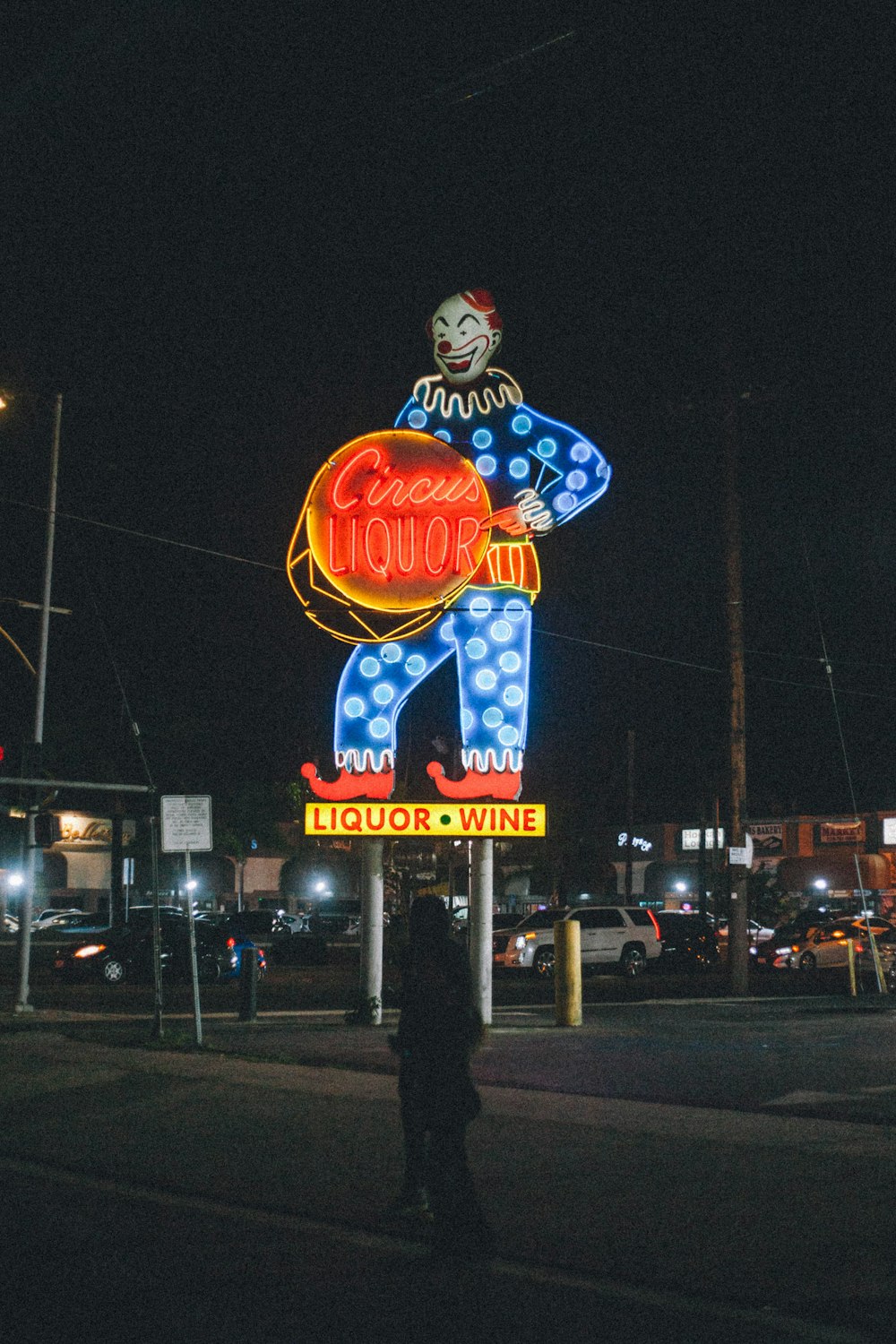 a person standing in front of a sign