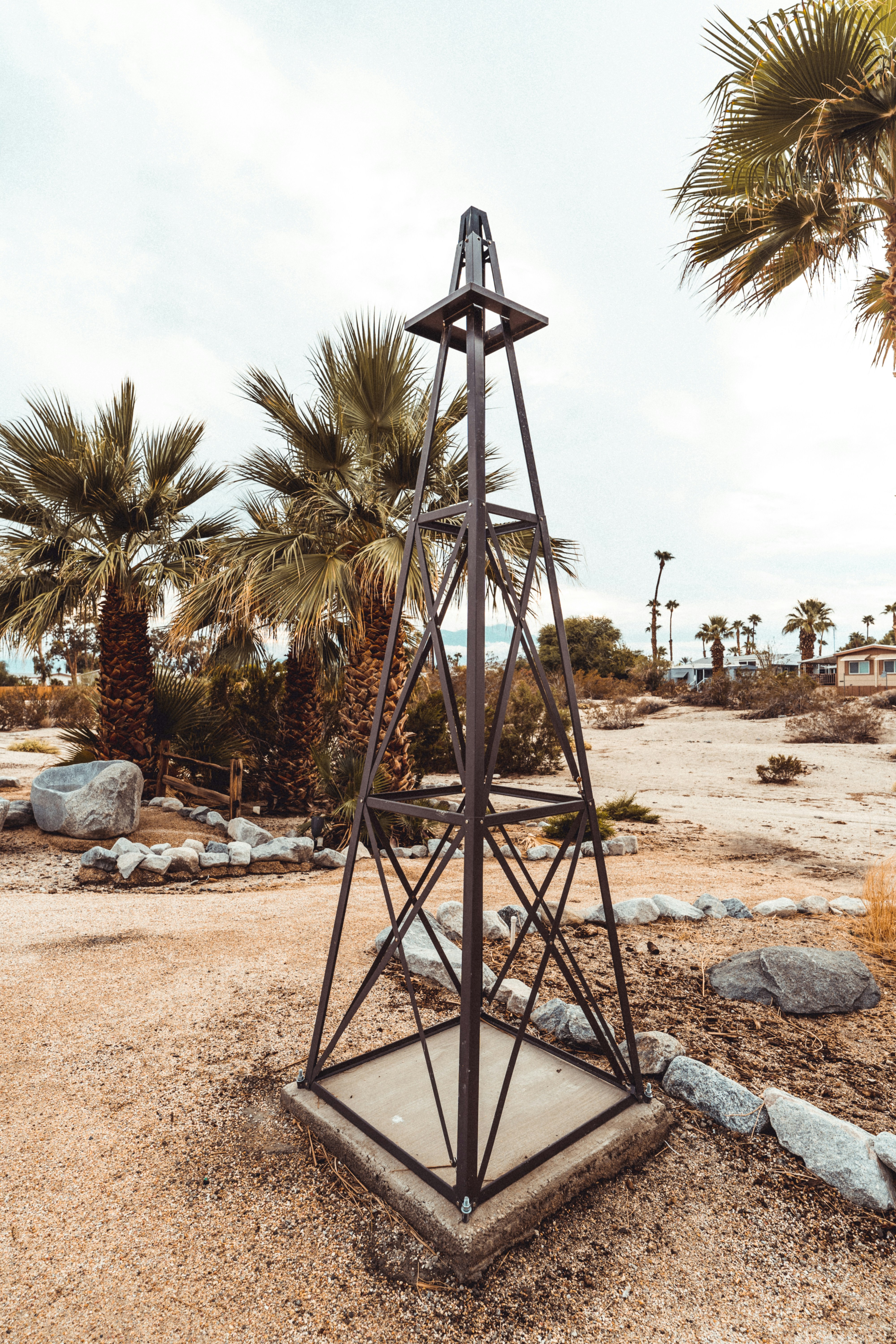 a sculpture in a sandy area