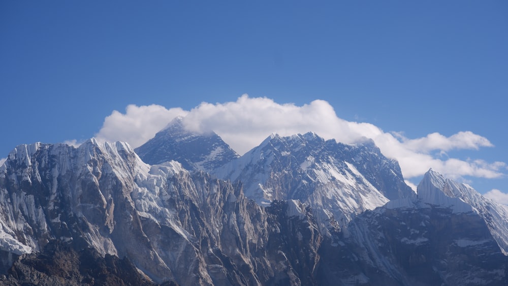 a mountain range with clouds