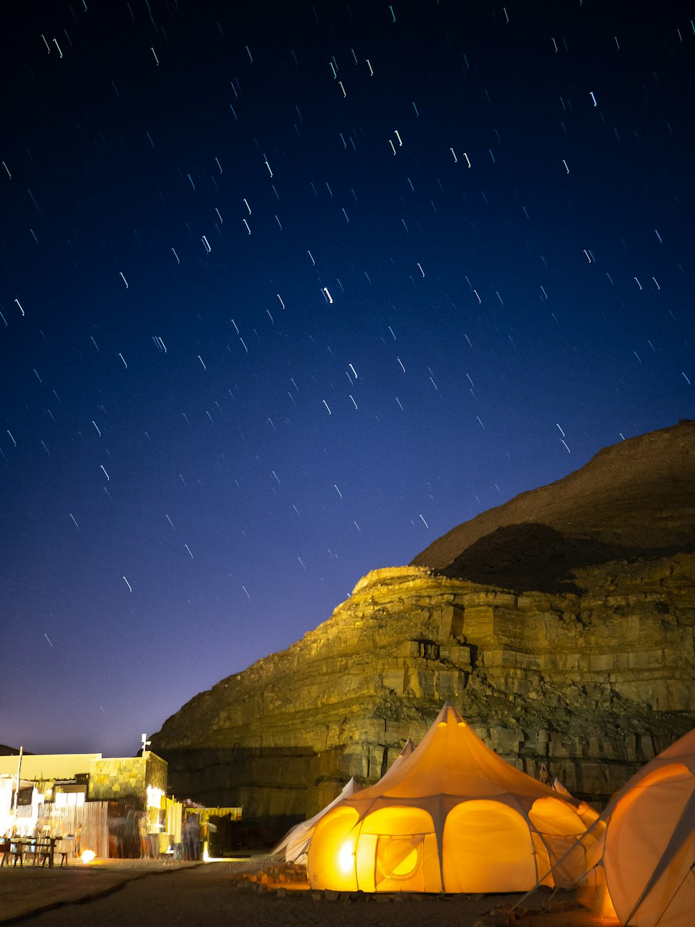 a tent with lights in the sky