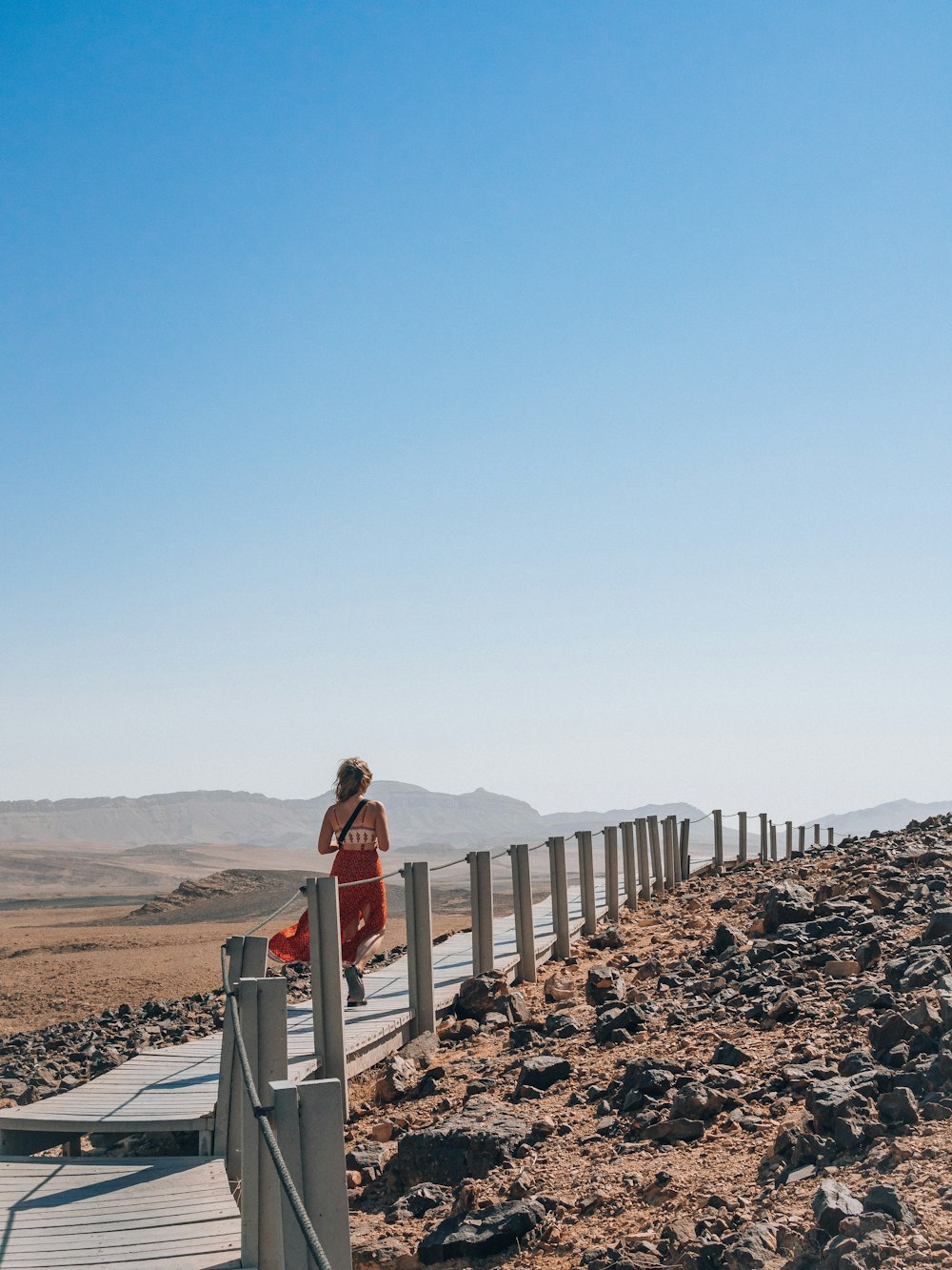 a person standing on a bridge